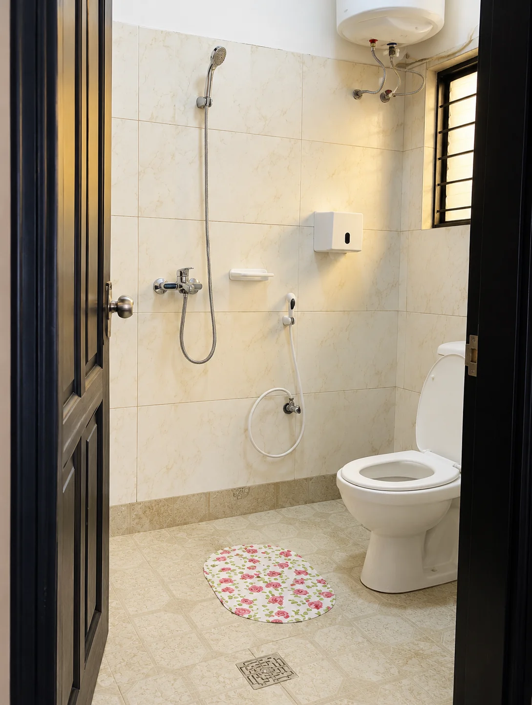 Private tiled bathroom with a shower